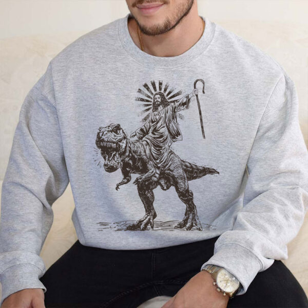 jesus riding a dinosaur sweater