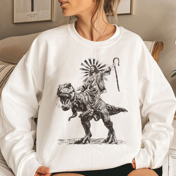 jesus riding a dinosaur sweater